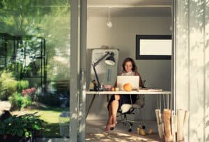 woman working from home in a garden office