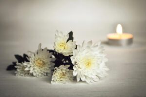 White flowers and a candle.
